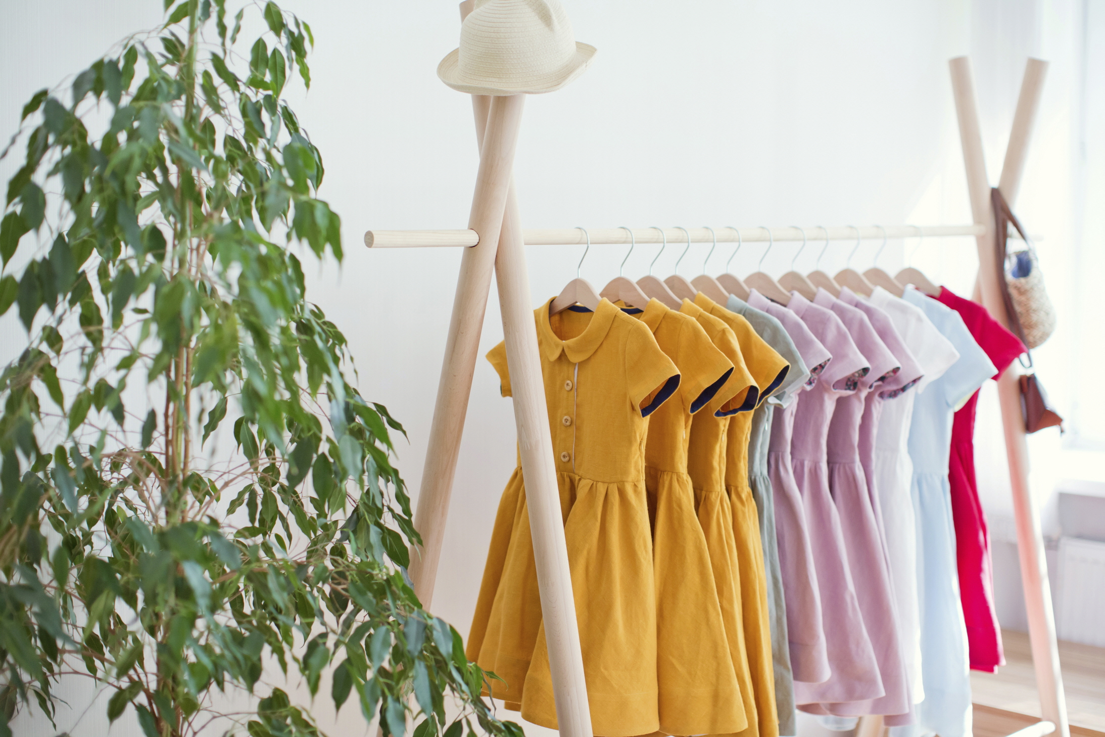 Dresses hanging in rack at store